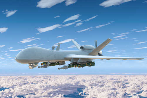 Combat,Drone,Fly,In,The,Blue,Sky,Above,The,Clouds.