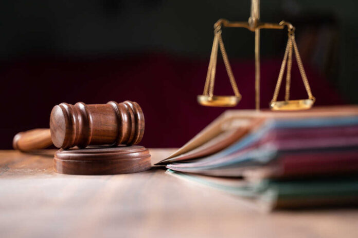 Focus,On,Hammer,,Group,Of,Files,On,Judge,Table,Covered