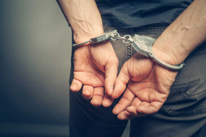 Male,Hands,In,Handcuffs
