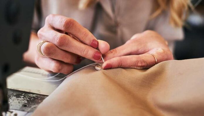 Sewing,Machine,,Woman,Hands,And,Clothing,Designer,With,Button,And