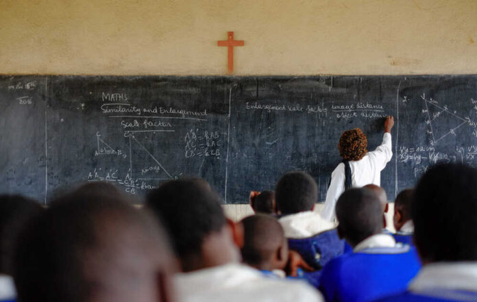 Teacher,And,Pupils,At,Mathematics,Lesson,In,A,Classroom,In