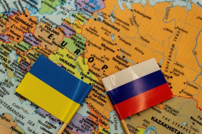The,Ukrainian,And,Russian,Flags,Are,Placed,On,A,Map