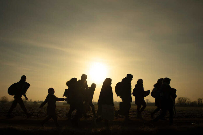 Migrants,Walk,Towards,The,Turkey's,Pazarkule,Border,Crossing,With,Greece's
