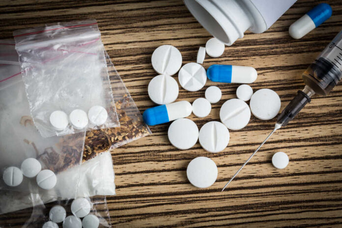 Drug,Syringe,And,Cooked,Heroin