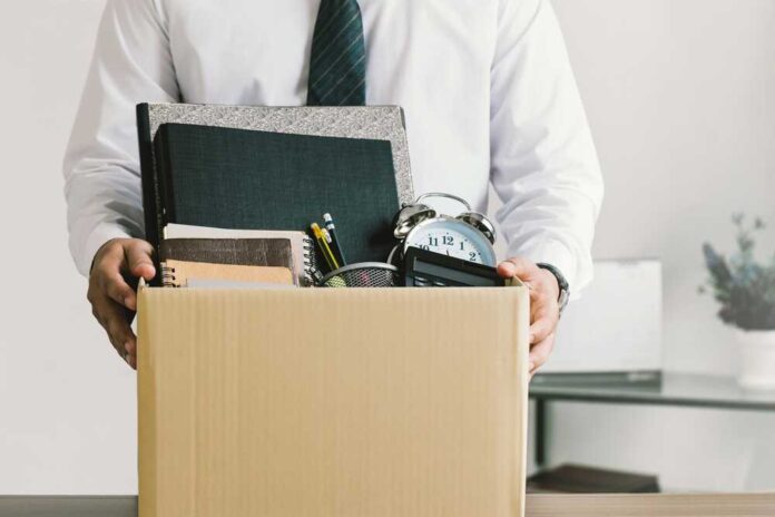 Resignation.,Businessmen,Holding,Boxes,For,Personal,Belongings,And,Resignation,Letters.quitting