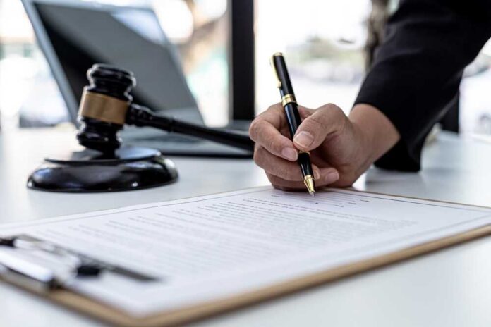 A,Male,Lawyer,Is,Signing,A,Plea,Agreement,With,A