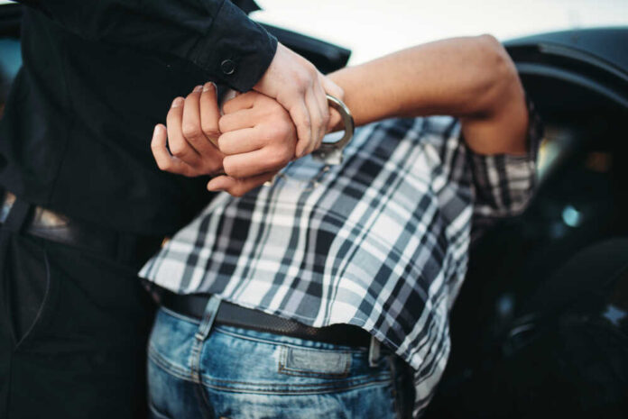 Policeman,Arrests,The,Car,Thief,On,Road