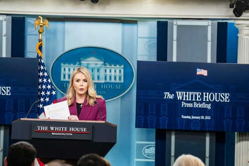 Person speaking at White House press briefing podium