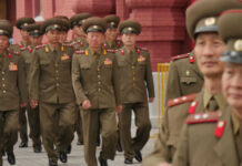 North Korea’s Rocket Storm Amid Rising Tensions Military officers marching together in uniform.