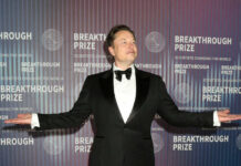 Musk’s Bold Step: Calls Judge’s Neutrality Into Question Man at Breakthrough Prize event in formal attire.
