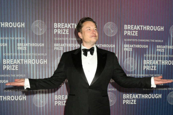 Man at Breakthrough Prize event in formal attire.
