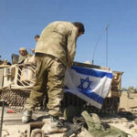 Israeli Hit: Civilian Jet Wrecked Near Nuclear Plant Soldiers setting Israeli flag on military vehicle tank