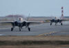 Iran’s Alleged F-35 Hit – U.S. Investigation Ongoing Two F-35 fighter jets on an airfield preparing for takeoff