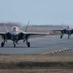 Iran’s Alleged F-35 Hit – U.S. Investigation Ongoing Two F-35 fighter jets on an airfield preparing for takeoff