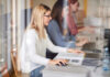 Female students engaged in a study session using laptops