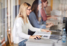 Female students engaged in a study session using laptops