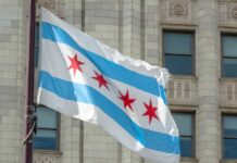 Chicago flag waving in front of a building