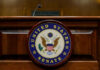 United States Senate emblem on wooden podium front