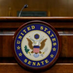 United States Senate emblem on wooden podium front