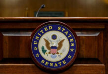 United States Senate emblem on wooden podium front