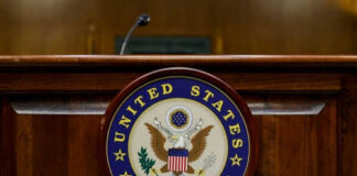 United States Senate emblem on wooden podium front