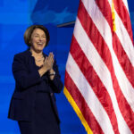 Gas Price Blame Game EXPLODES in Democrat’s Face I dont know who this is clapping near flag