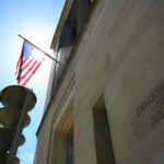 United States flag Department of Justice building exterior