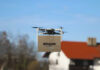 Amazon delivery drone flying with package