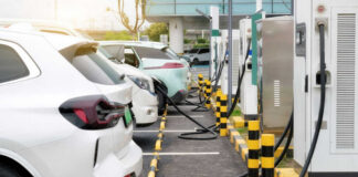 Electric cars charging at a charging station parking.