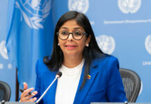 A woman in a blue suit speaking at a United Nations conference