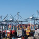 Cranes and shipping containers at a busy port
