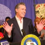 Fiscal Mismanagement May Bankrupt the Golden State California governor speaking at a public event with supporters