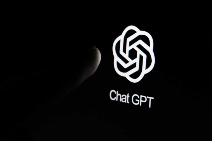 Close-up of a hand reaching towards the ChatGPT logo on a smartphone screen
