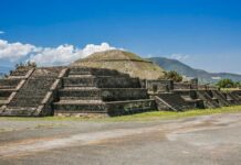 Ancient pyramid ruins under a clear blue sky