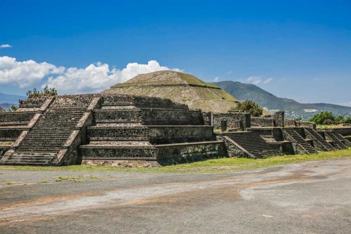 Ancient pyramid ruins under a clear blue sky