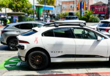 Waymo selfdriving car parked on city street