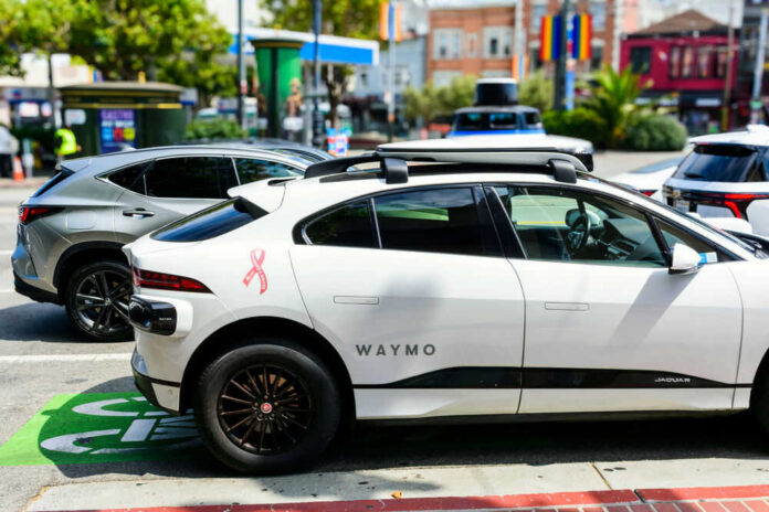 Waymo selfdriving car parked on city street