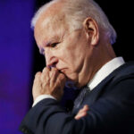 Judge HALTS Biden Audio Release: What’s Hidden? elderly man in suit resting chin on hand in thought