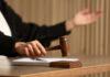State Power Clash: Parents Lose Custody in Gender Cases Judge's hand striking a wooden gavel on a block