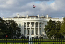 Gun Attack at the White House: The Trump Administration Is Being TARGETED The White House with an American flag flying above it