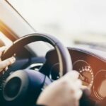 Felony Shock: Ex-Federal Prosecutor in Hit-and-Run Scandal Hands gripping a steering wheel inside a car