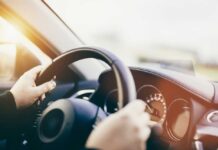 Felony Shock: Ex-Federal Prosecutor in Hit-and-Run Scandal Hands gripping a steering wheel inside a car