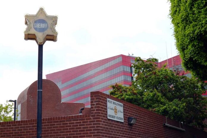 shutterstock_2336313535.jpg Sheriff station sign with a star emblem in West Hollywood
