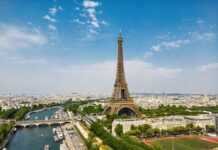 Priceless Eiffel Fragment: SOLD to Highest Bidder! Aerial view of the Eiffel Tower in Paris with the Seine River and cityscape