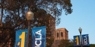UCLA campus with banners displaying '#1' and 'UCLA' near a historic building