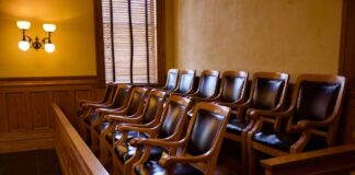 Empty jury box with wooden chairs in a courtroom