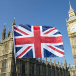 Union Jack flag in front of Big Ben and the Houses of Parliament