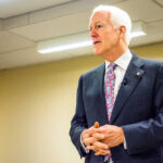 Betrayal Vibes? Senator John Cornyn Drops Cryptic Fable A man in a suit delivering a speech in a conference room