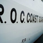 Taiwan Pushback: Chinese Ship Tests Waters, Goes Dark R.O.C. Coast Guard lettering on the side of a white ship at dock