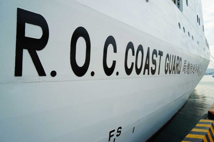 R.O.C. Coast Guard lettering on the side of a white ship at dock